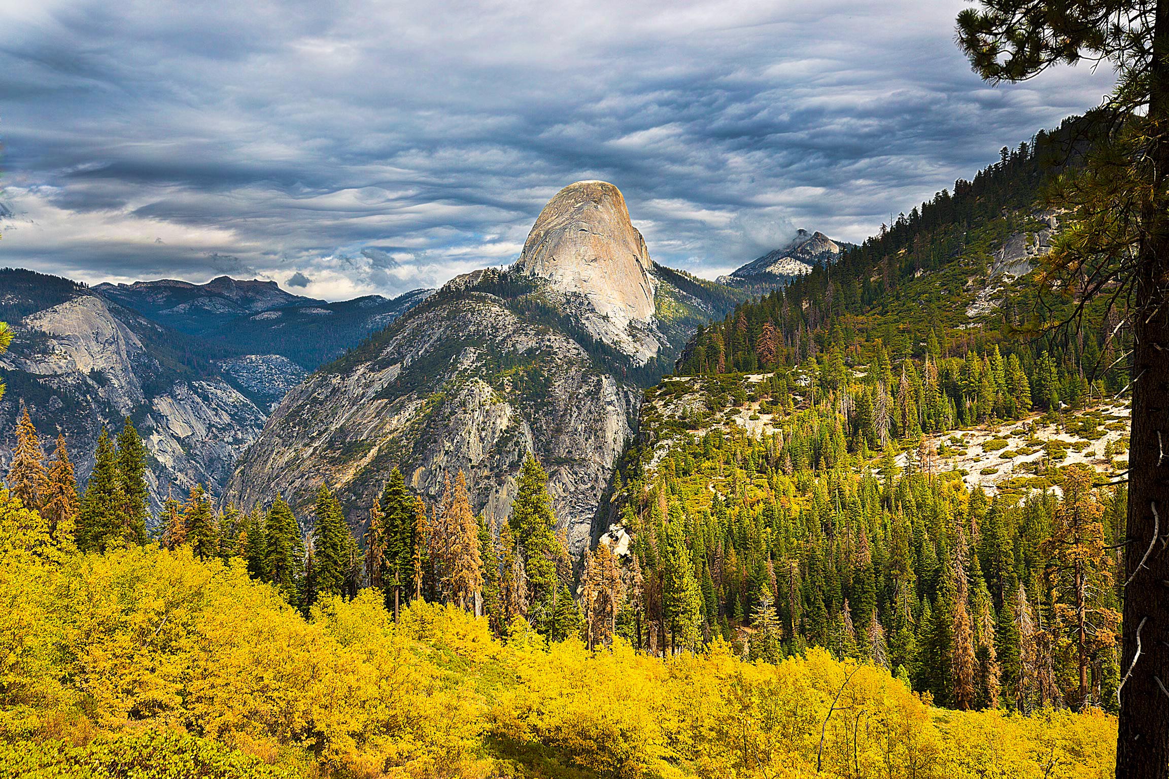 The Half-Dome from the backside with beautiful Fall leaves in the foreground- this was taken right near the junction between the John Muir Trail and the Panorama Trail.  