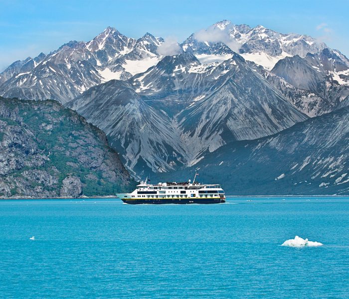 A ferry passes amidst the glaciers in Glacier Bay National Park