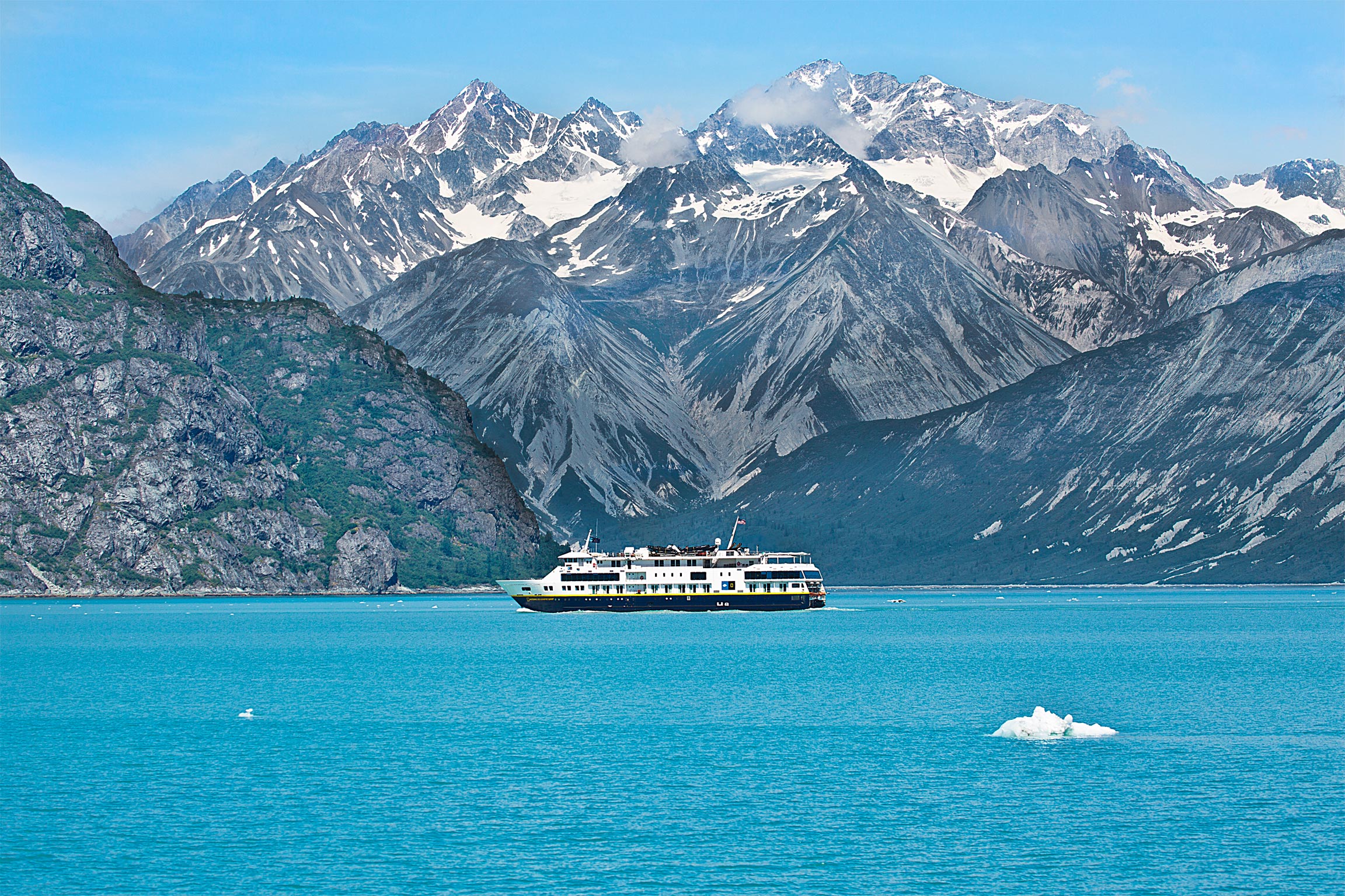 A ferry passes amidst the glaciers in Glacier Bay National Park